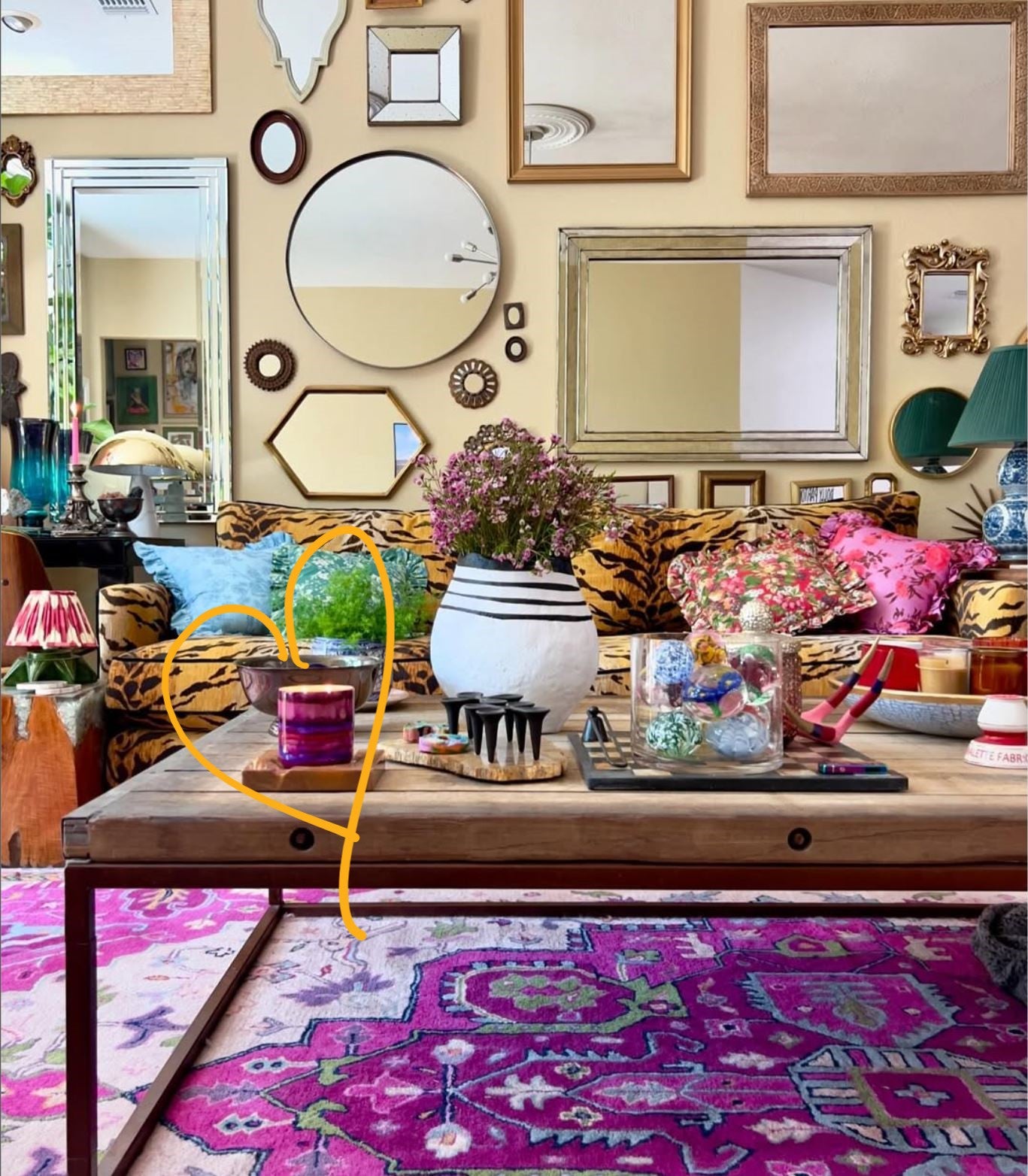 colorful eclectic living space with burning candle