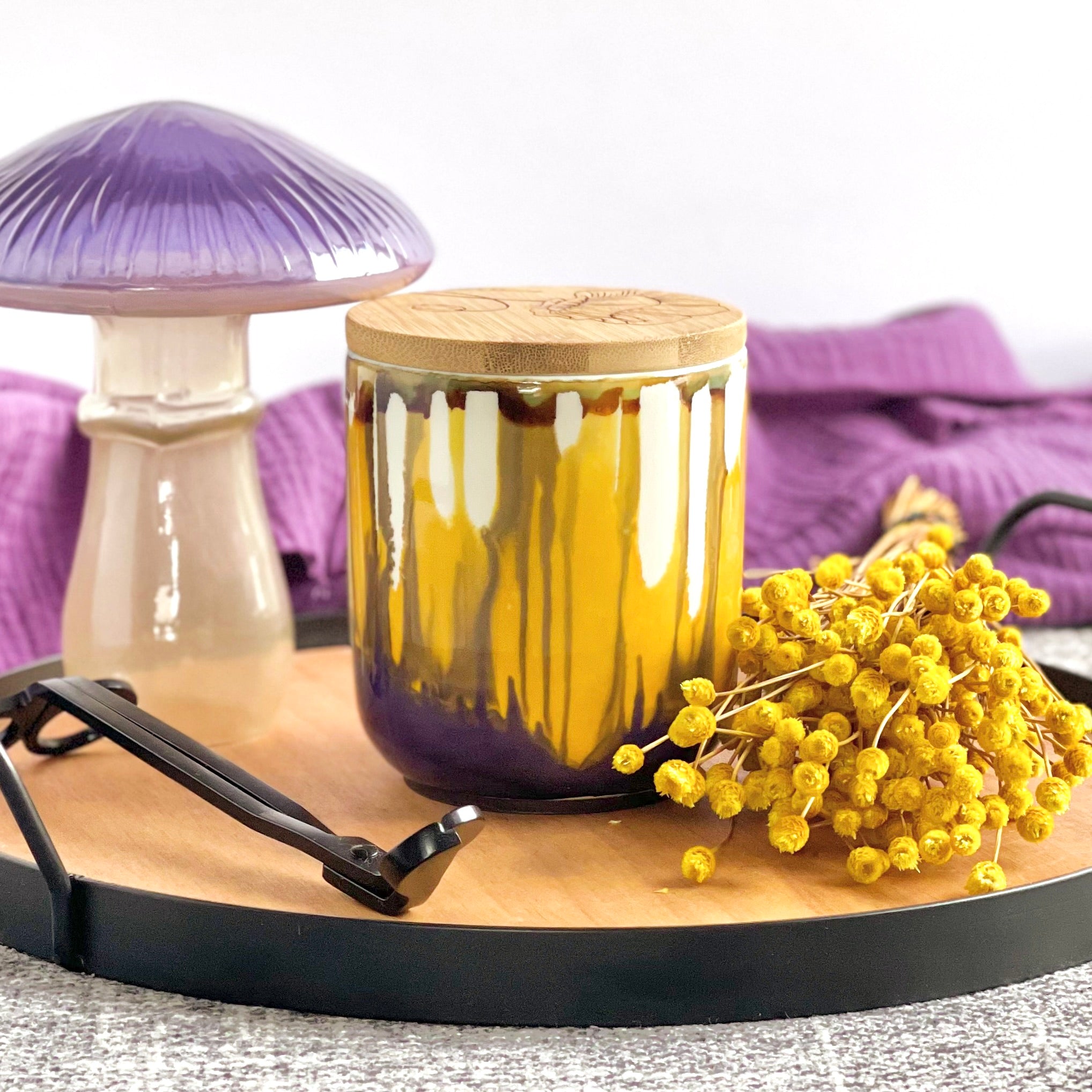 Tall, two wick ceramic candle handpainted in softly blended warm yellows and muted purples