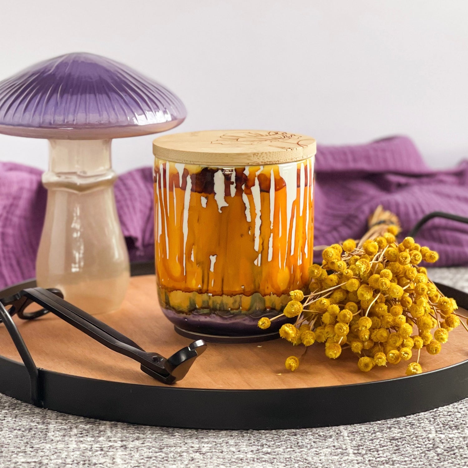 Drippy golden yellow and burnt orange with a bit of smoky purple around the base. Handpainted ceramic candle, unique candles for fall