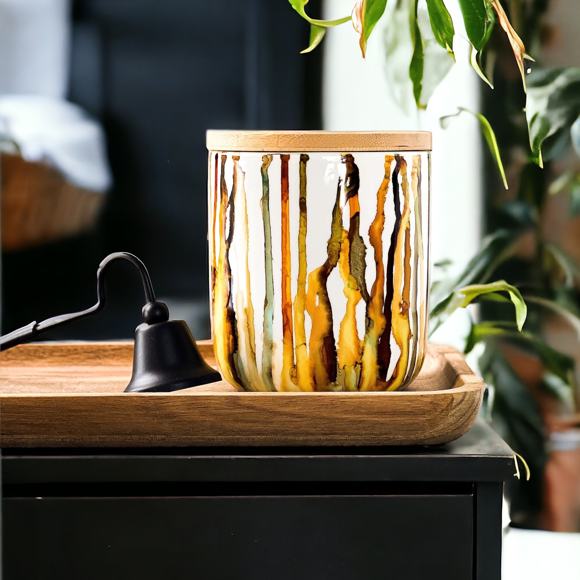 Tall candle handpainted in warm browns and golds