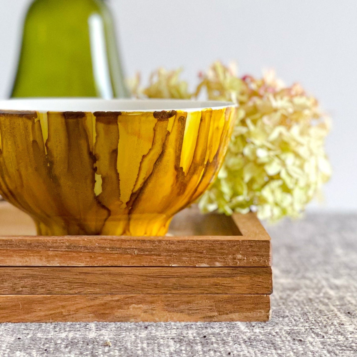 golden yellow and tawny brown handpainted three wick ceramic candle with a slight shimmer