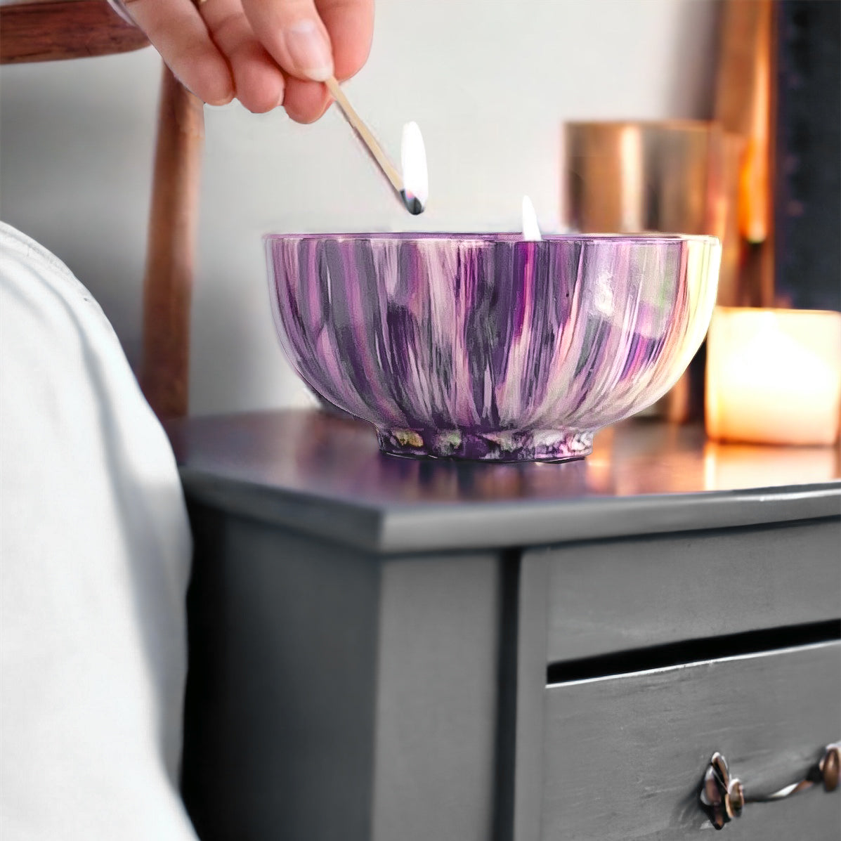 Ceramic three wick candle handpainted in purples and pinks with touches of blue