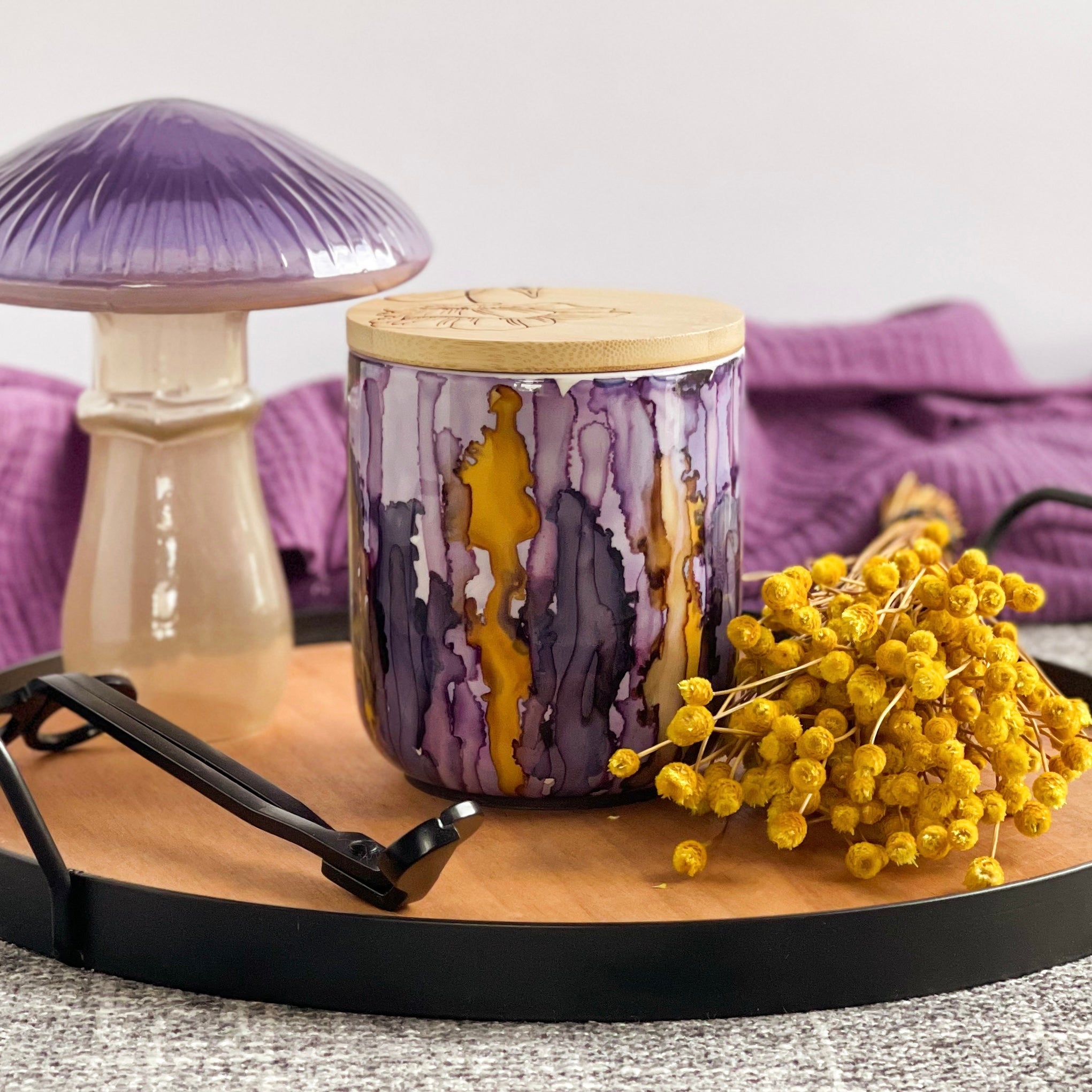 Handpainted ceramic candle in shades of plum and violet accented with golden yellow, unique candles for fall