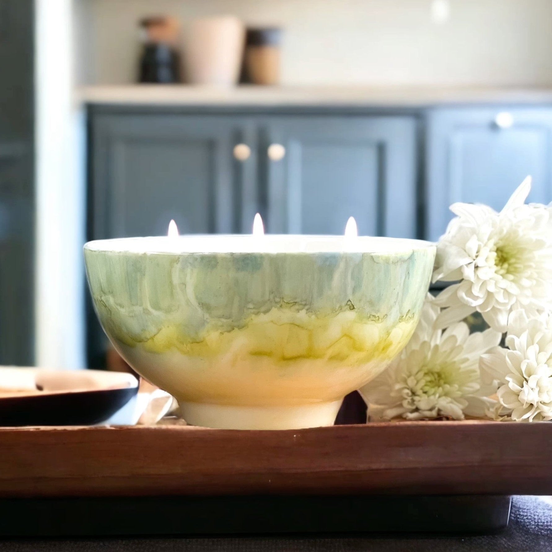 Ceramic soy candle handpainted in soft grayish green and pale yellow