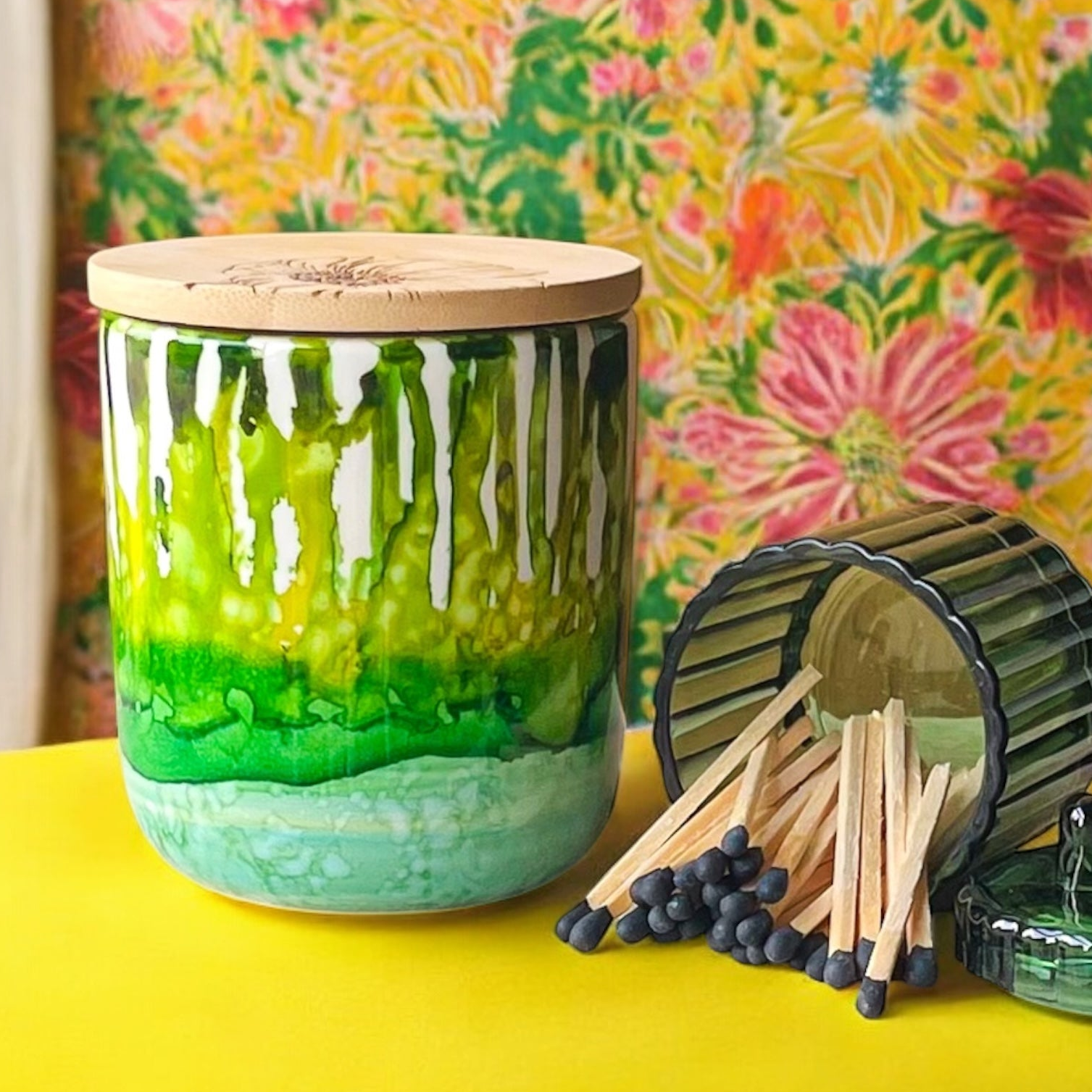 Tall, two wick ceramic soy candle handpainted in layers of mottled greens