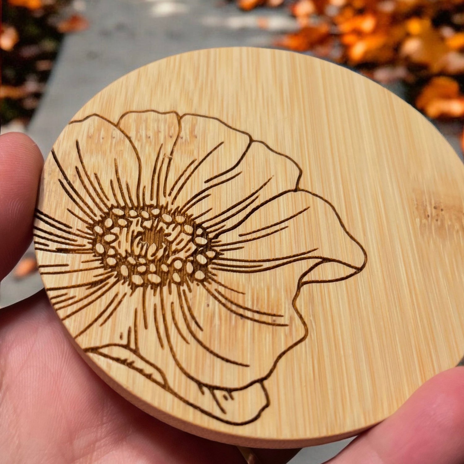 Up close detail of the engraved detail on a Tall Candle bamboo lid