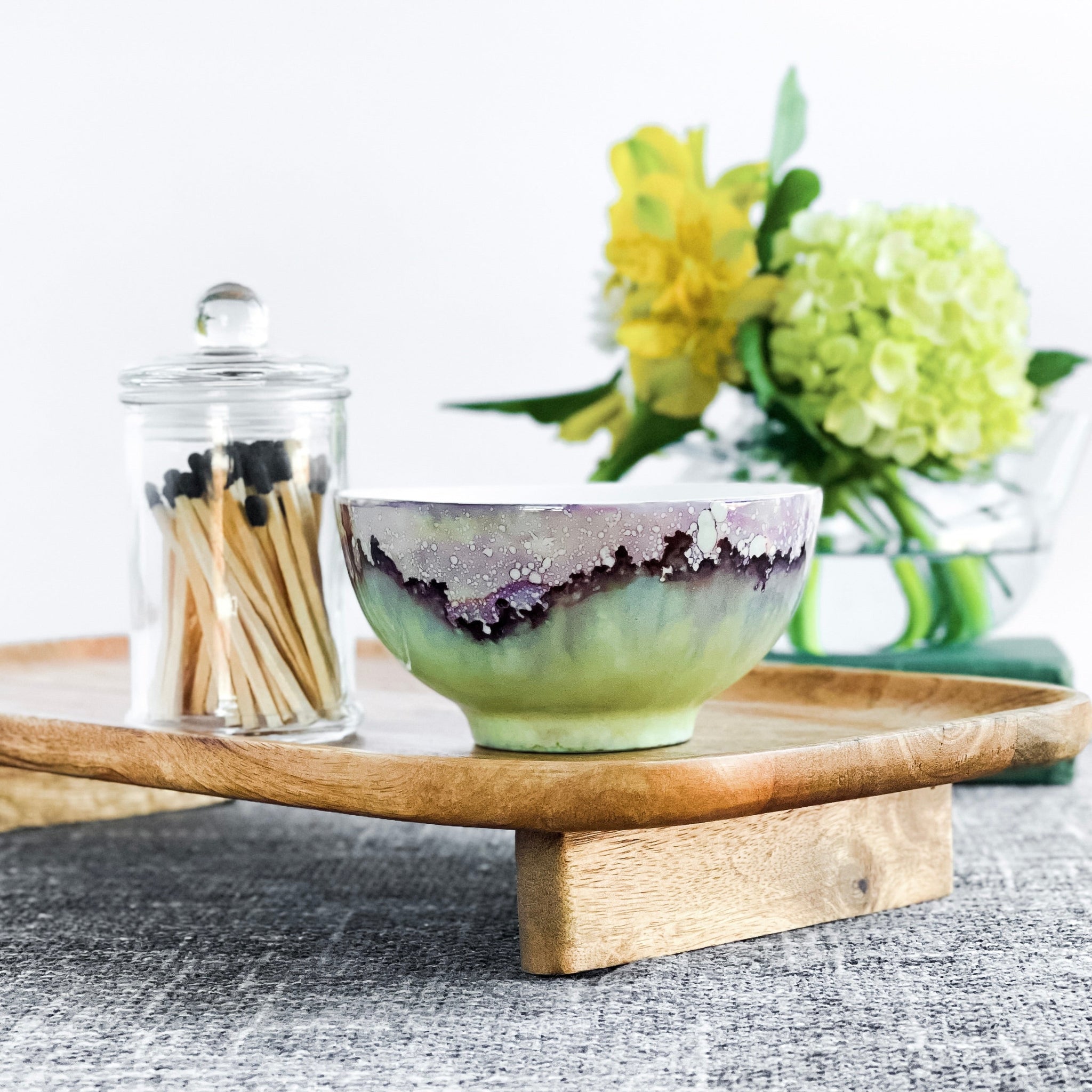 Handpainted ceramic candle in soft green and purple