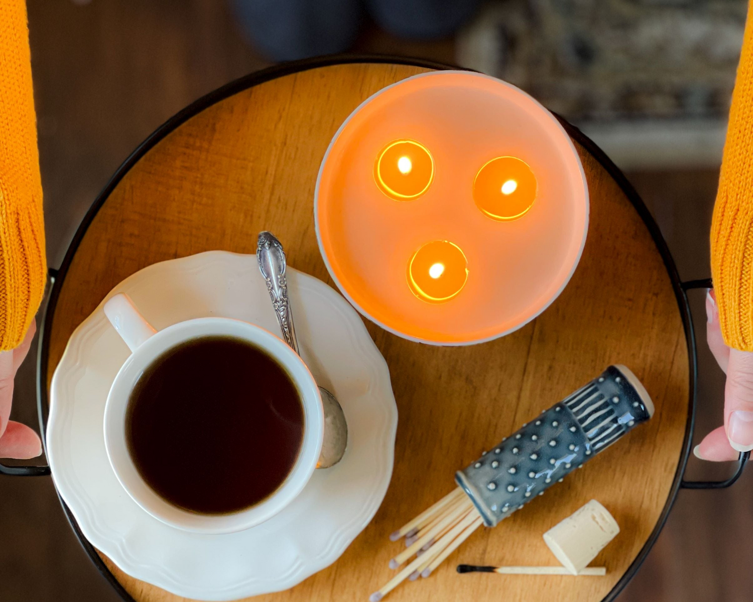 Top view of a three wick candle burning