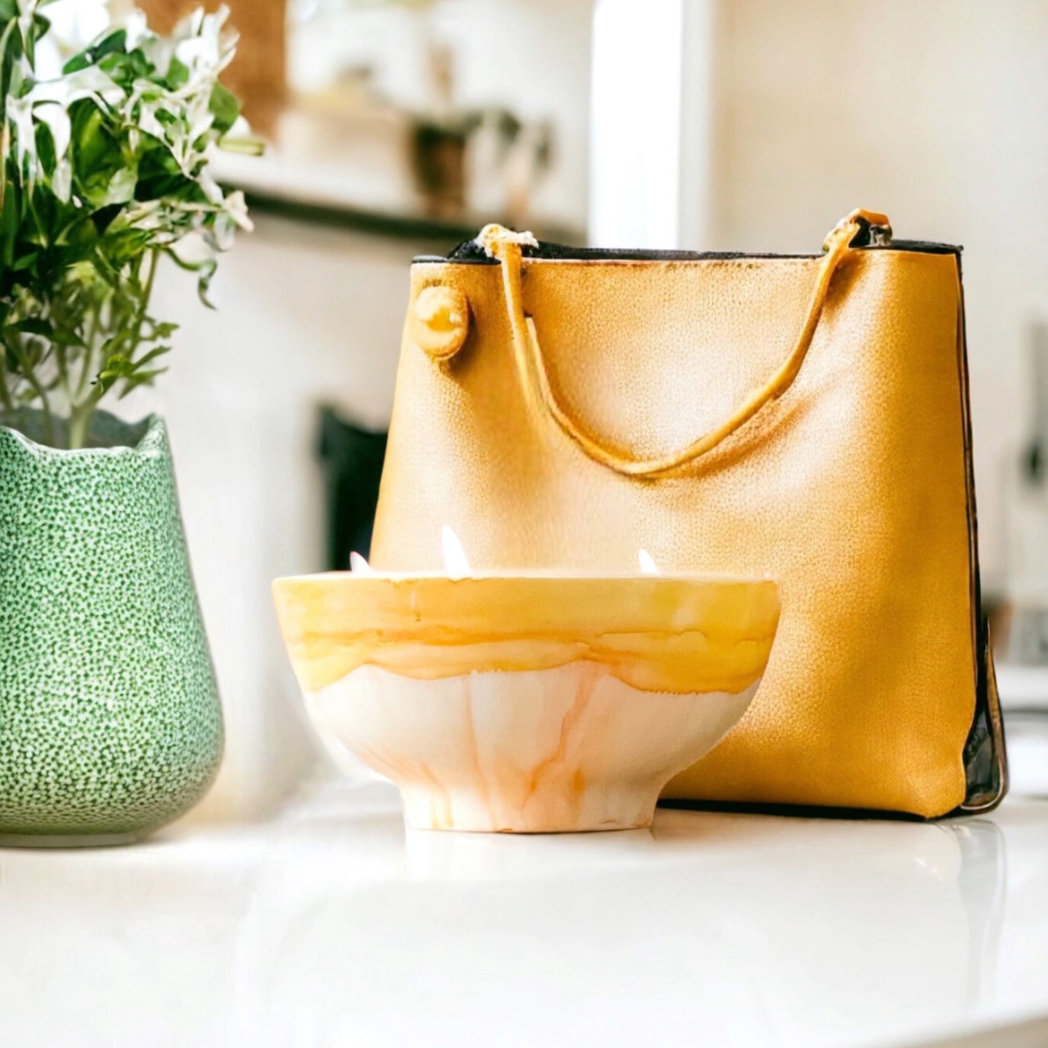 soft orange and apricot colored hand painted ceramic candle