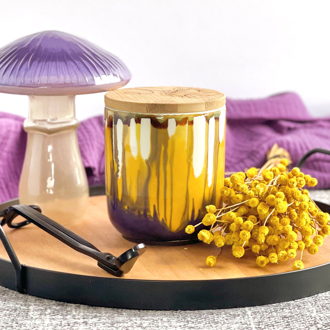 Tall, two wick ceramic candle handpainted in softly blended warm yellows and muted purples