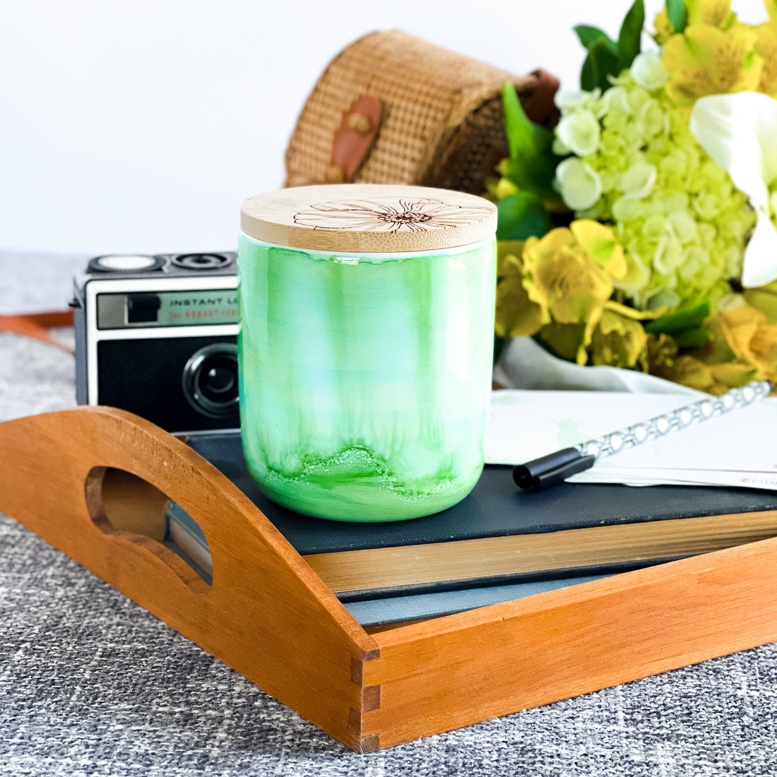 Tall, two wick ceramic soy candle handpainted in layers of greens and a hint of teal