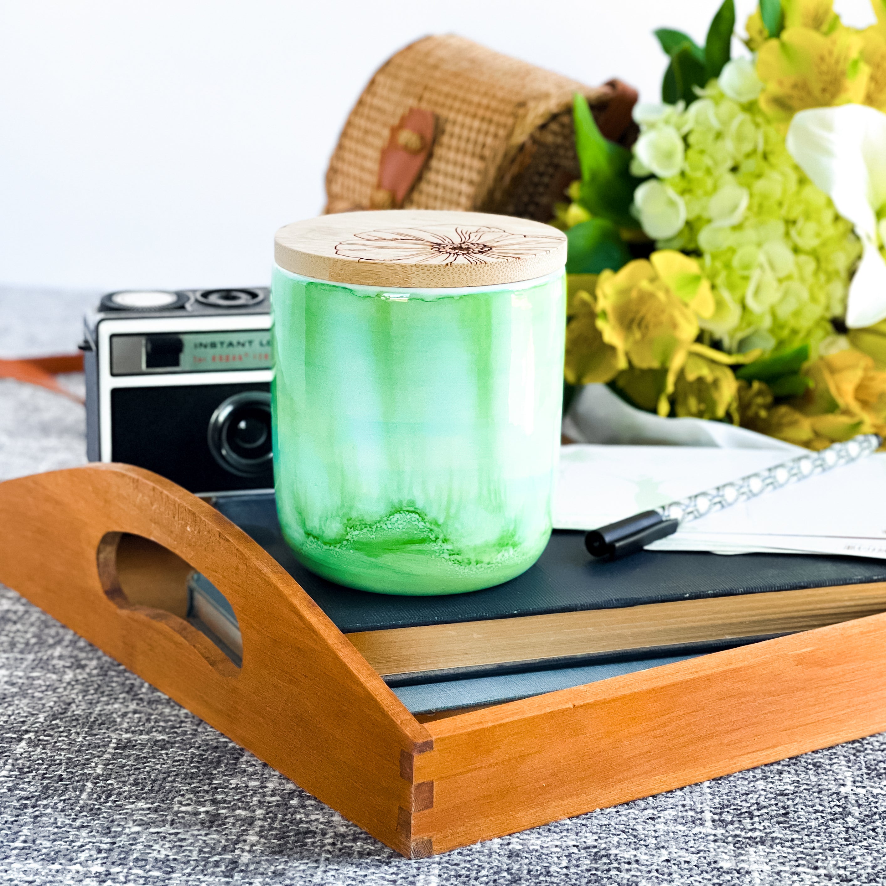 Tall, two wick ceramic soy candle handpainted in layers of greens and a hint of teal
