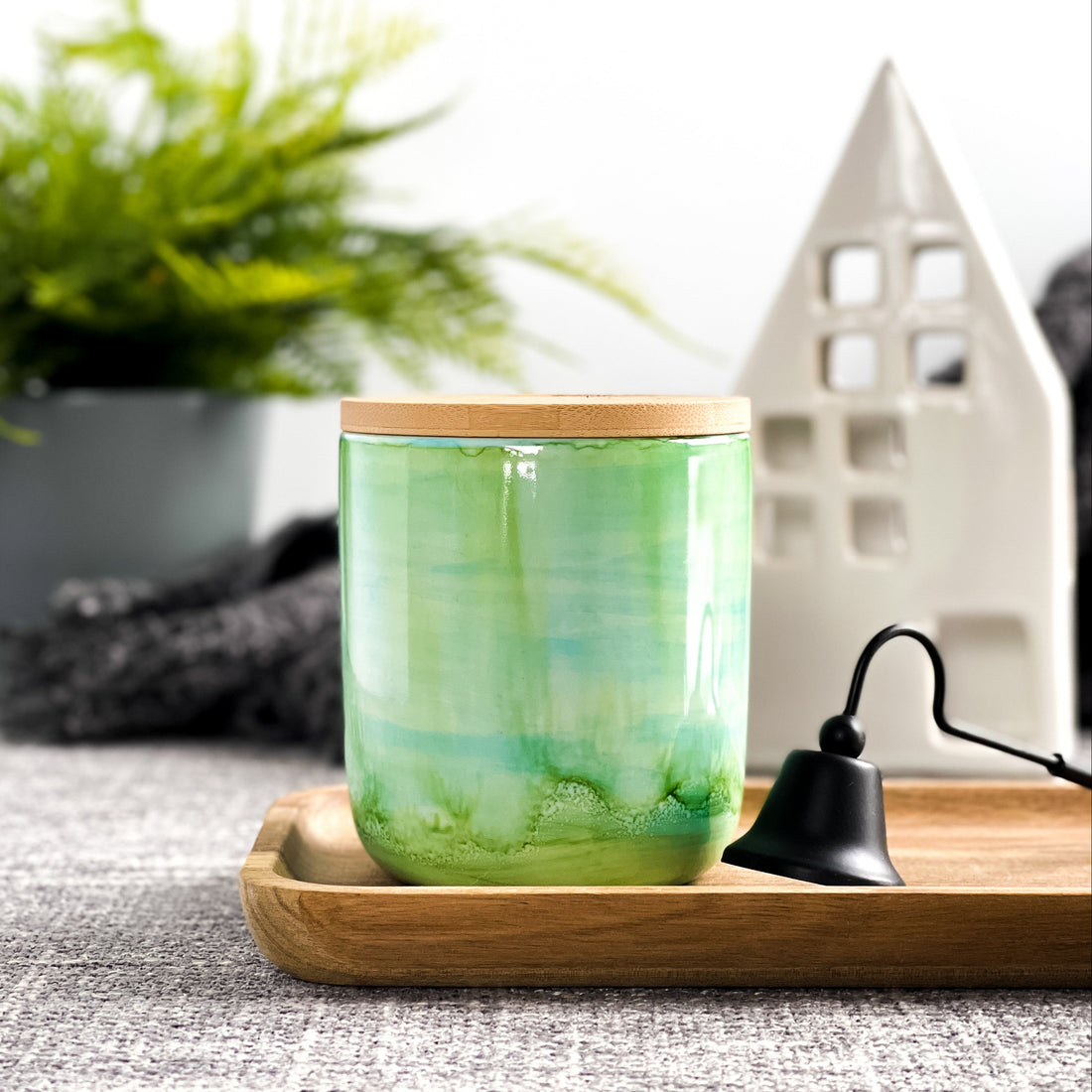 Tall, two wick ceramic soy candle handpainted in layers of greens and a hint of teal