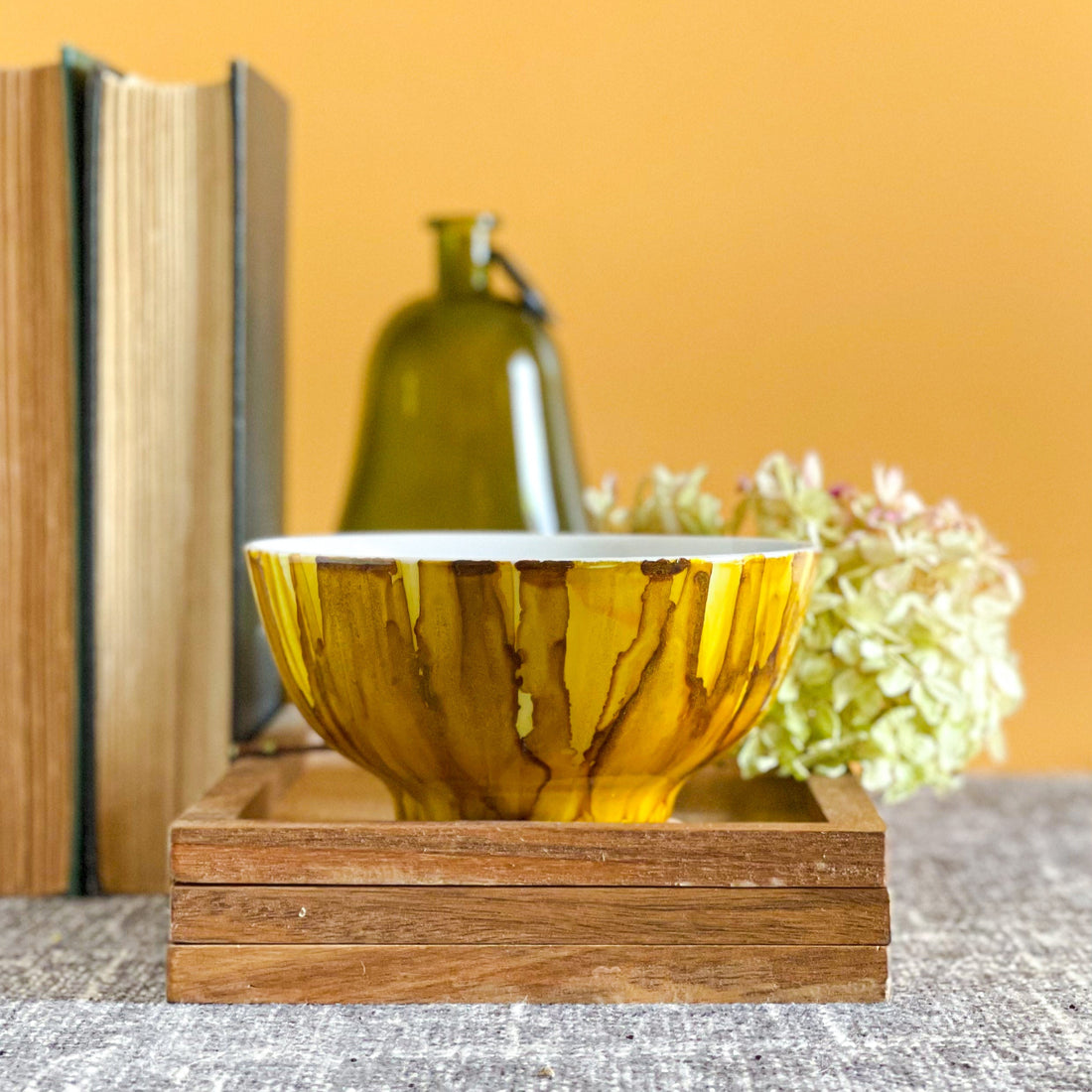 golden yellow and tawny brown handpainted three wick ceramic candle with a slight shimmer