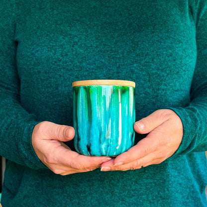 Tall, two wick ceramic soy candle handpainted in vibrant shades of teal