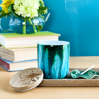 Tall, two wick ceramic soy candle handpainted in vibrant shades of teal