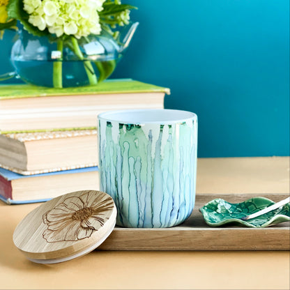 Tall, two wick ceramic soy candle handpainted in soft blues and pale greens