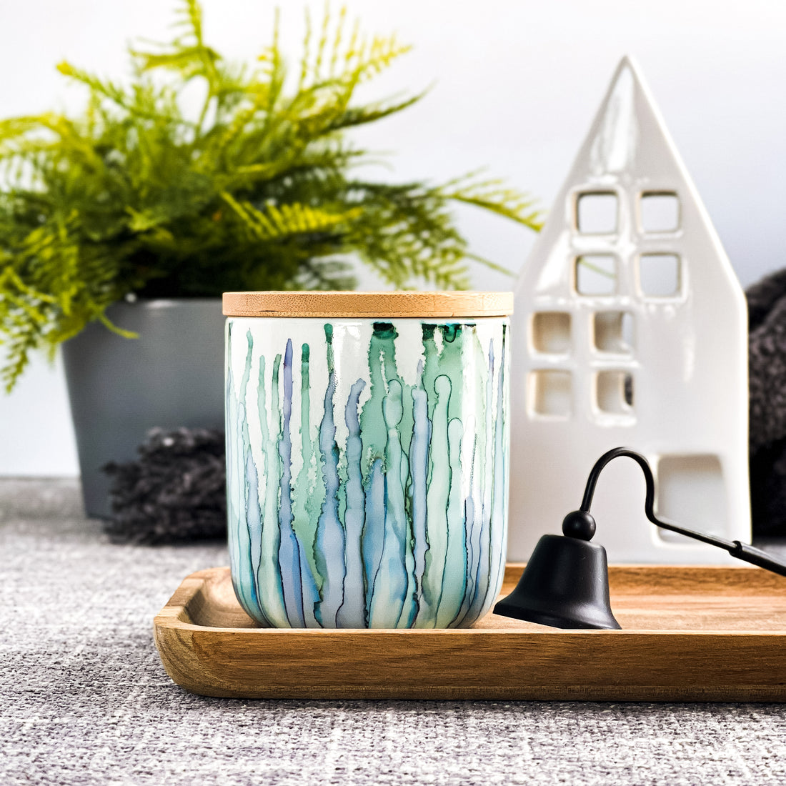 Tall, two wick ceramic soy candle handpainted in soft blues and pale greens