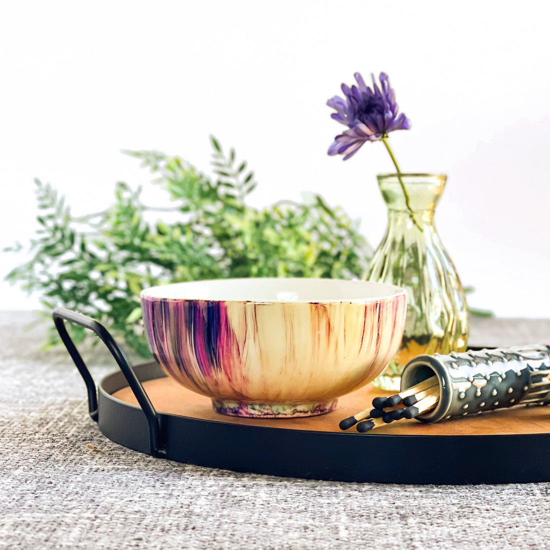 Ceramic three wick candle handpainted in purples and pinks with touches of blue