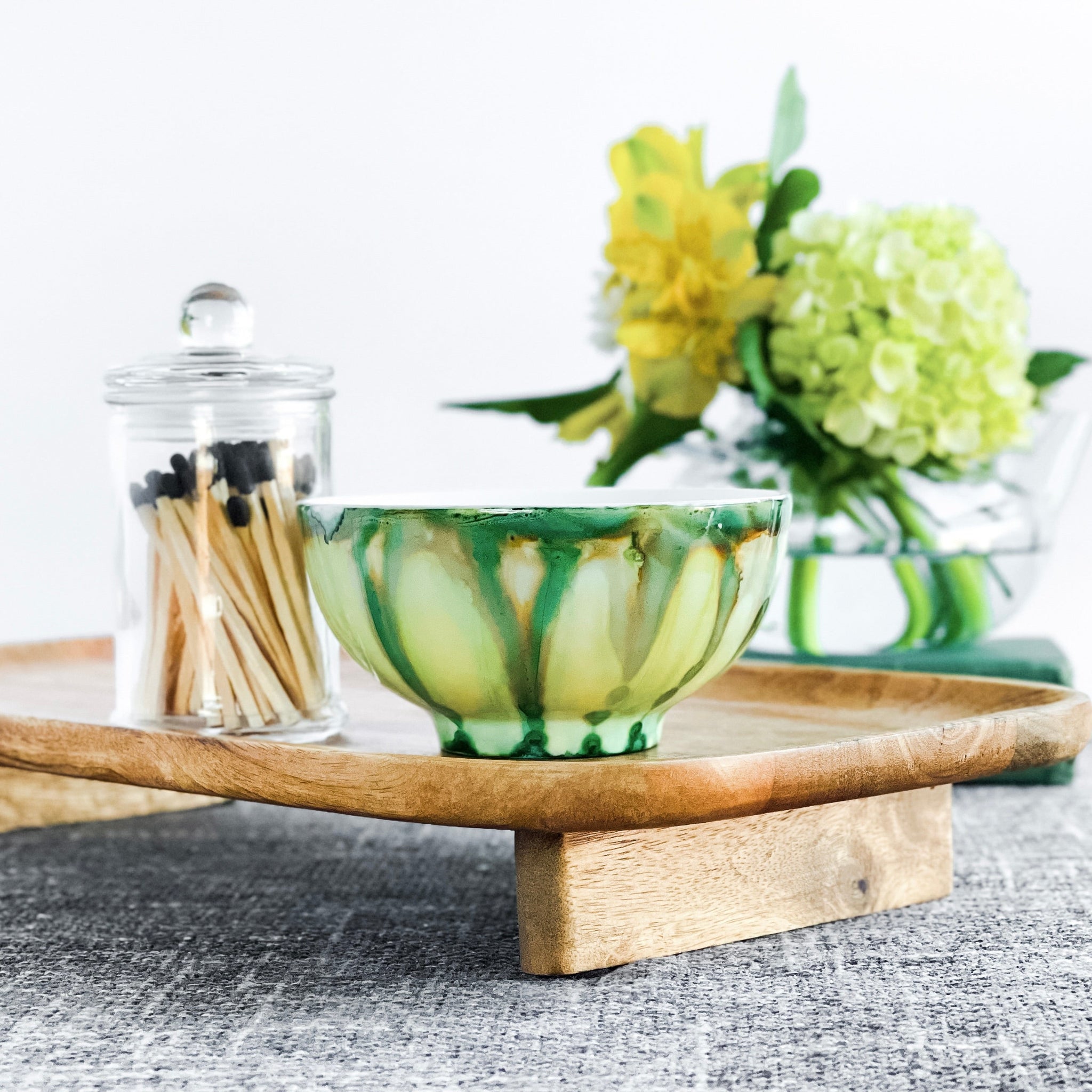 Handpainted, three wick ceramic candle in muted layers of green and yellow
