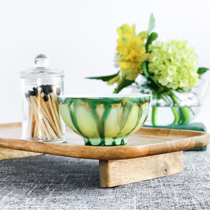 Handpainted, three wick ceramic candle in muted layers of green and yellow