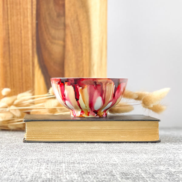 Soft red and tan fall candle in a ceramic vessel, unique candle for fall