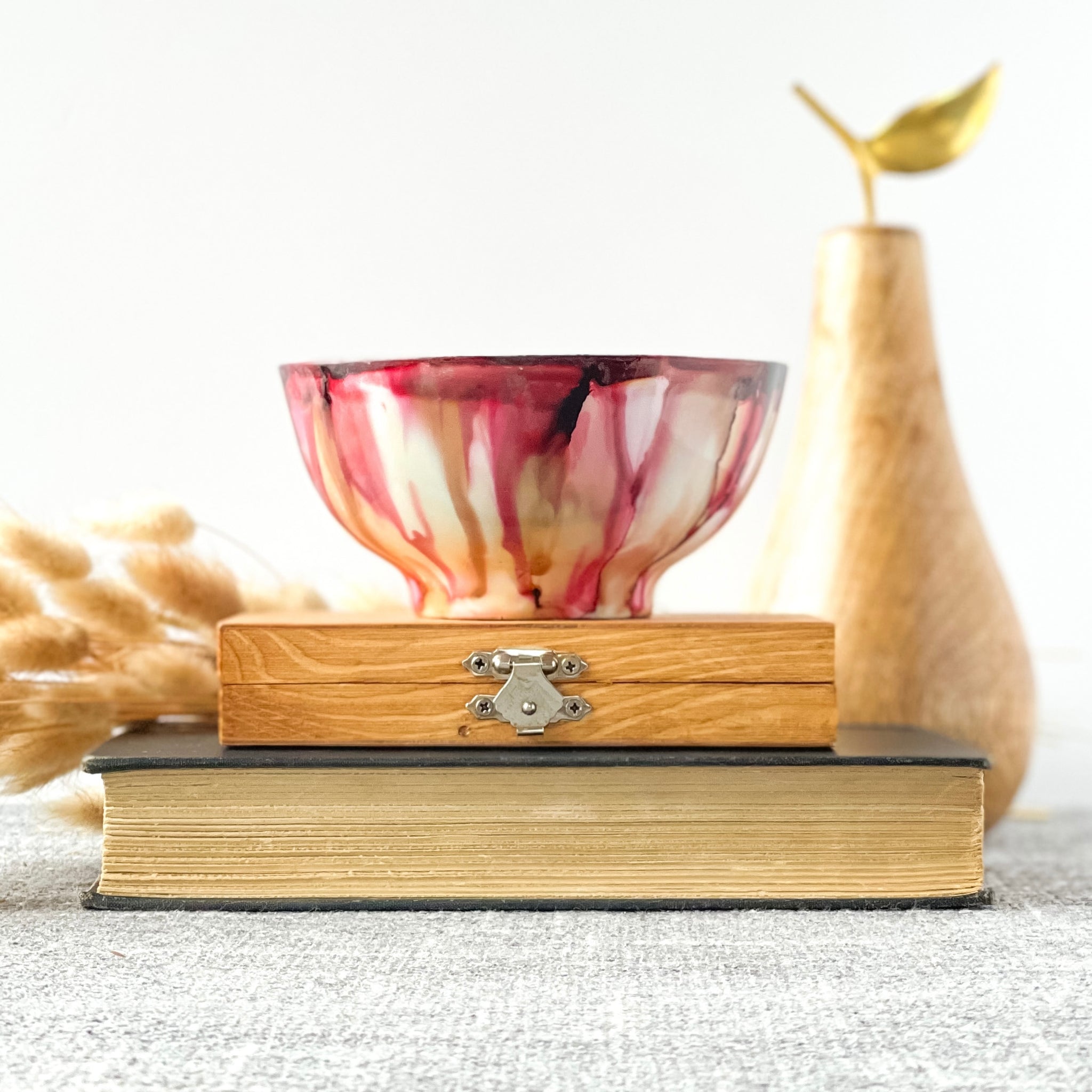 Soft red and tan fall candle in a ceramic vessel, unique candle for fall