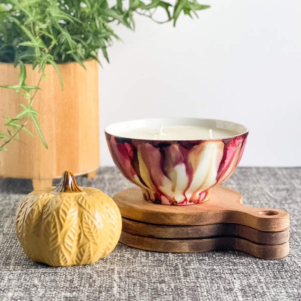 Soft red and tan fall candle in a ceramic vessel, unique candle for fall