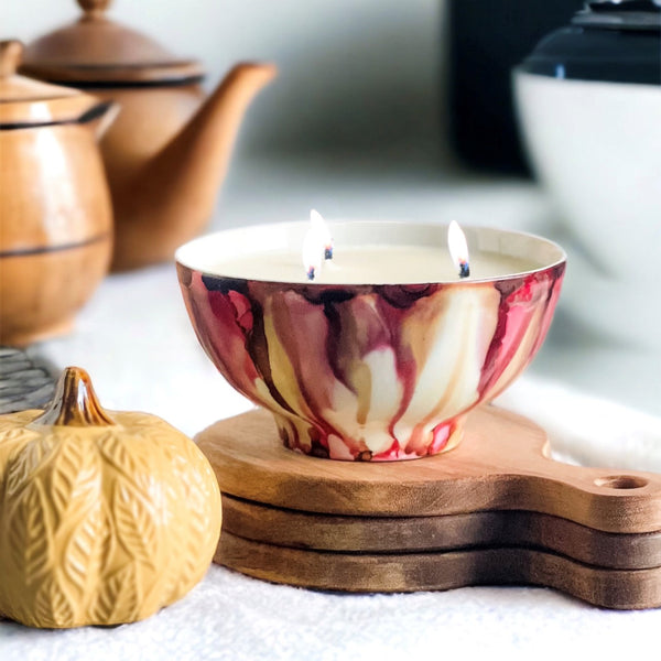 Soft red and tan fall candle in a ceramic vessel, unique candle for fall