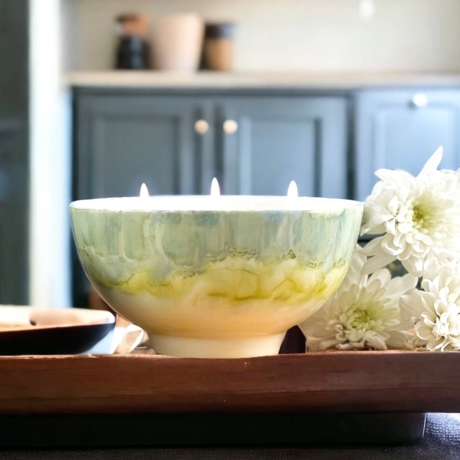 Ceramic soy candle handpainted in soft grayish green and pale yellow