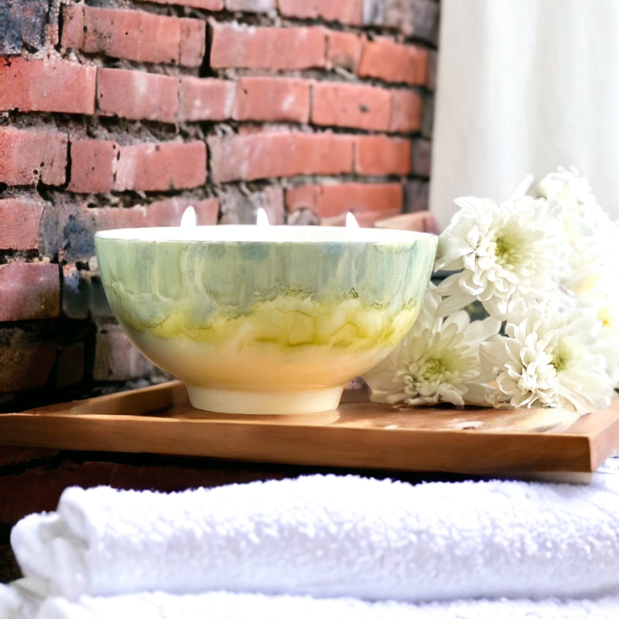 Ceramic soy candle handpainted in soft grayish green and pale yellow 
