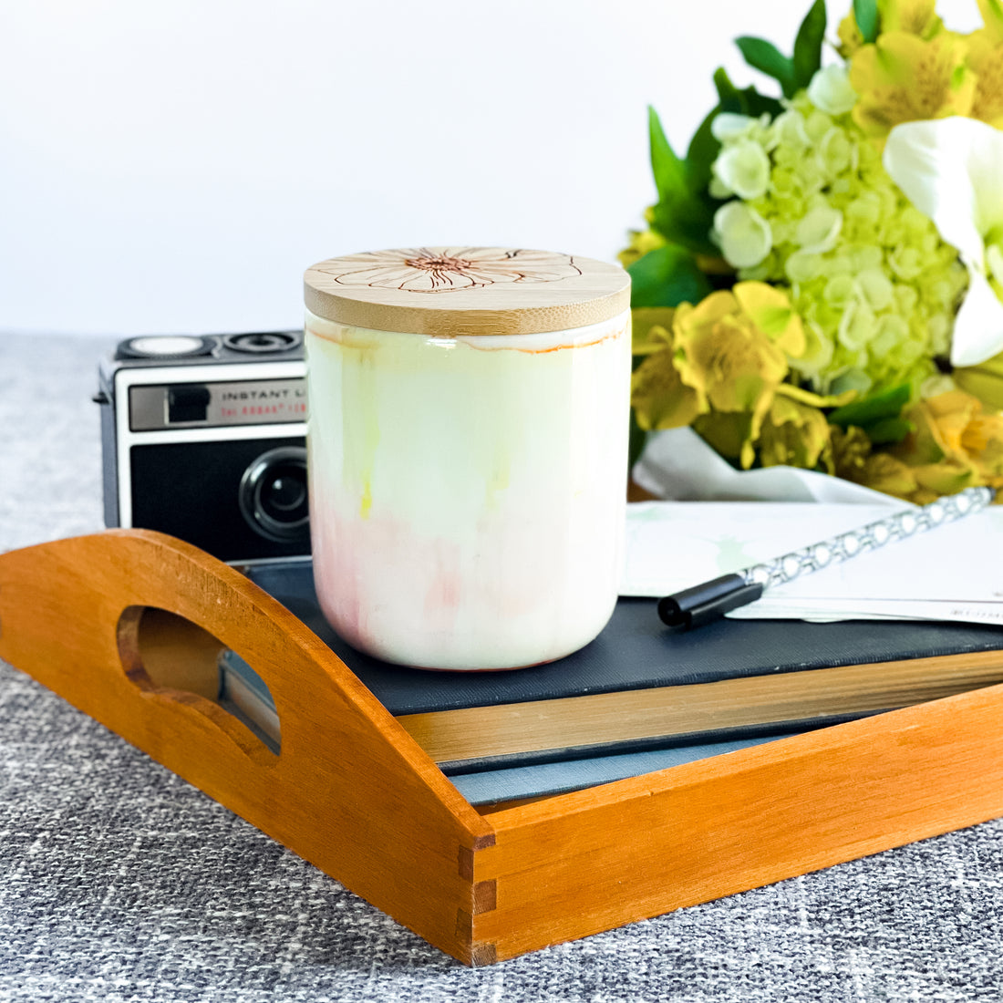 Tall, two wick soy candle handpainted in pale pinks and yellows