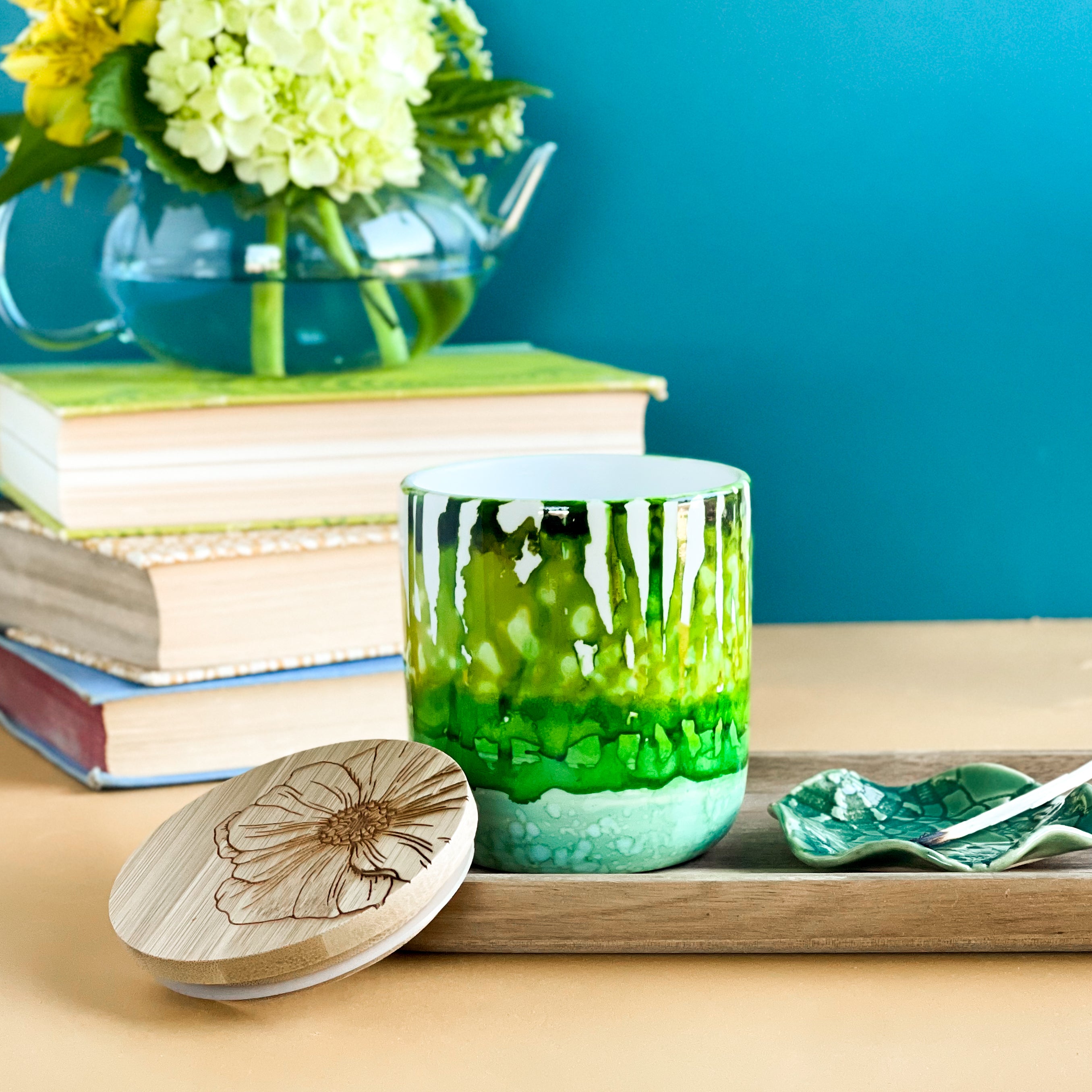 Tall, two wick ceramic soy candle handpainted in layers of mottled greens
