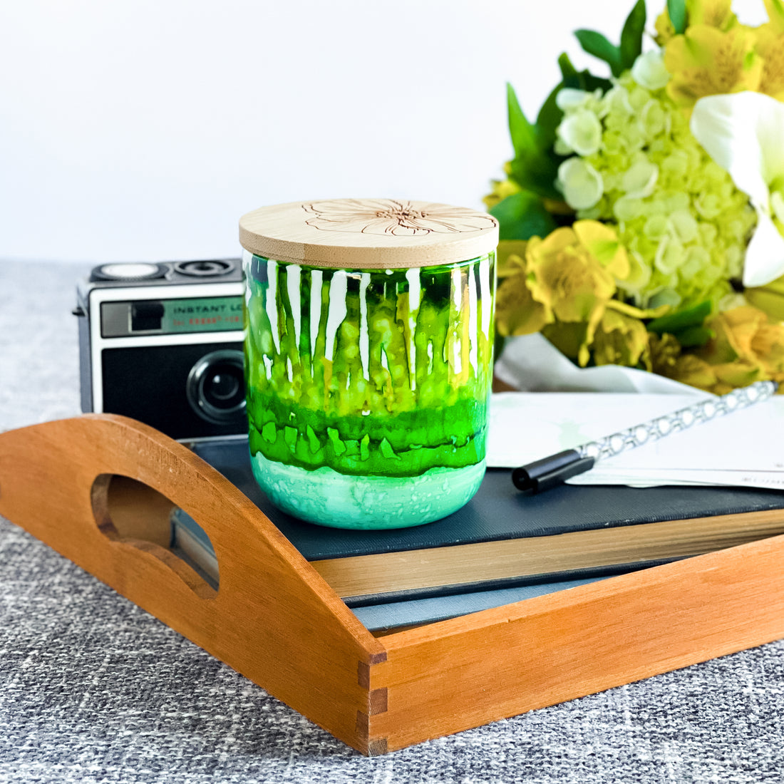 Tall, two wick ceramic soy candle handpainted in layers of mottled greens