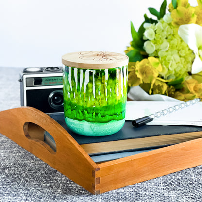 Tall, two wick ceramic soy candle handpainted in layers of mottled greens