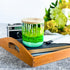 Tall, two wick ceramic soy candle handpainted in layers of mottled greens