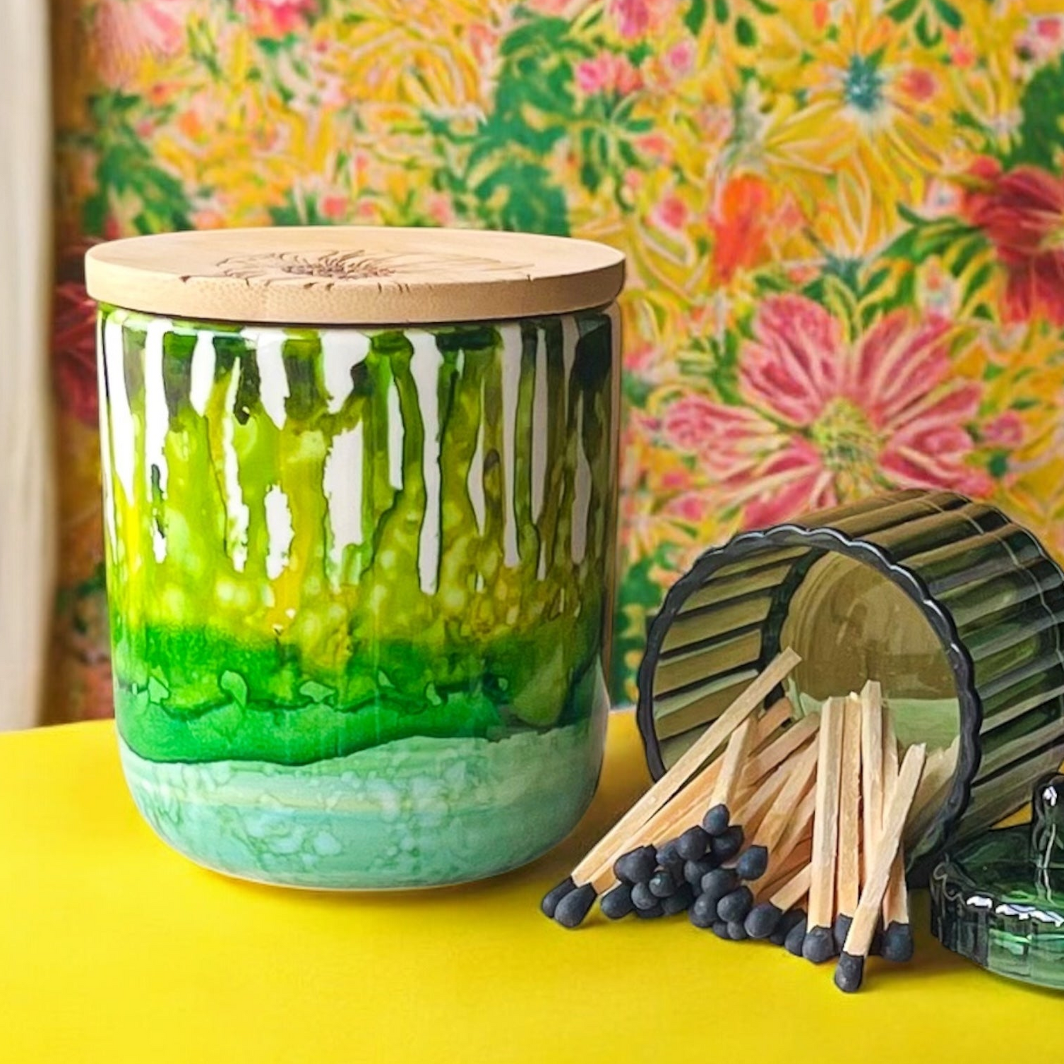 Tall, two wick ceramic soy candle handpainted in layers of mottled greens