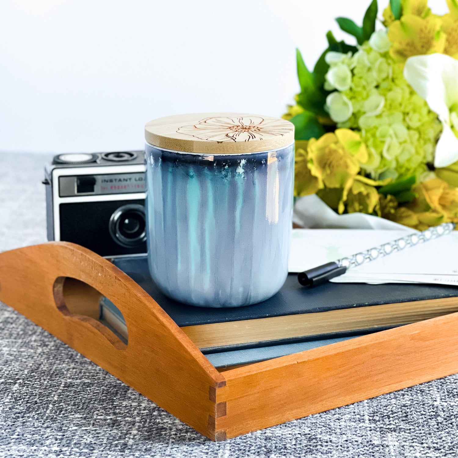 Tall, two wick ceramic soy candle handpainted in soft, blended shades of blue