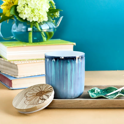 Tall, two wick ceramic soy candle handpainted in soft, blended shades of blue