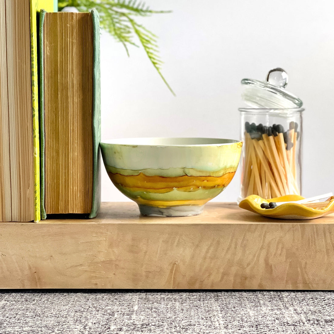 Handpainted, three wick ceramic candle in soft layered beachy tones 