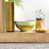 Handpainted, three wick ceramic candle in soft layered beachy tones 