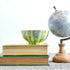 Handpainted ceramic candle in soft shades of blue, yellow and green
