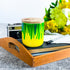 Tall, two wick ceramic soy candle handpainted in bright green and sunny yellow