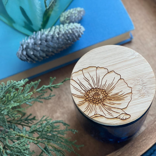 Top view of a hand painted ceramic candle with bamboo lid