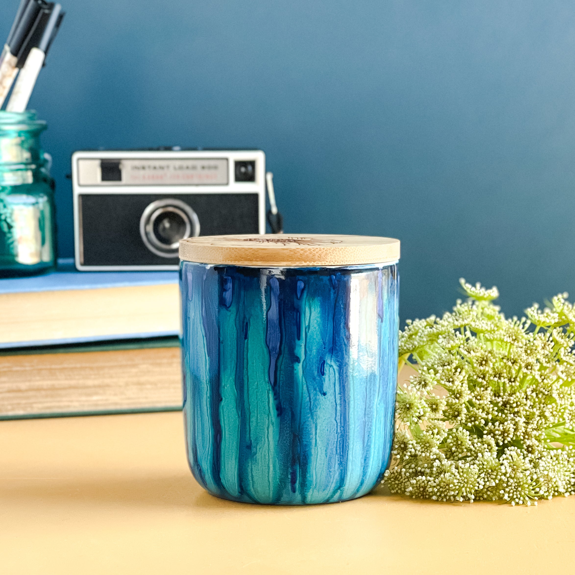 Tall, two wick ceramic soy candle handpainted in beautiful blues and deep teal