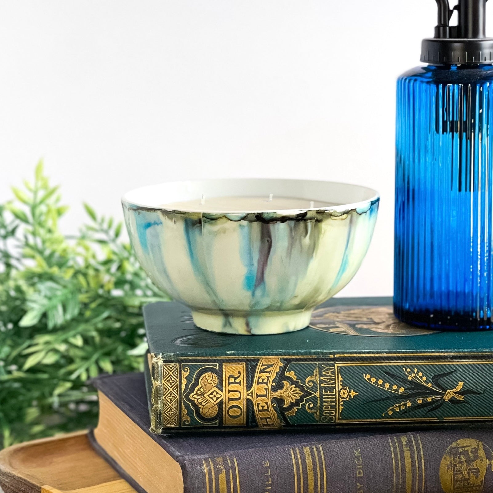 Handpainted ceramic candle in soft blues and grays