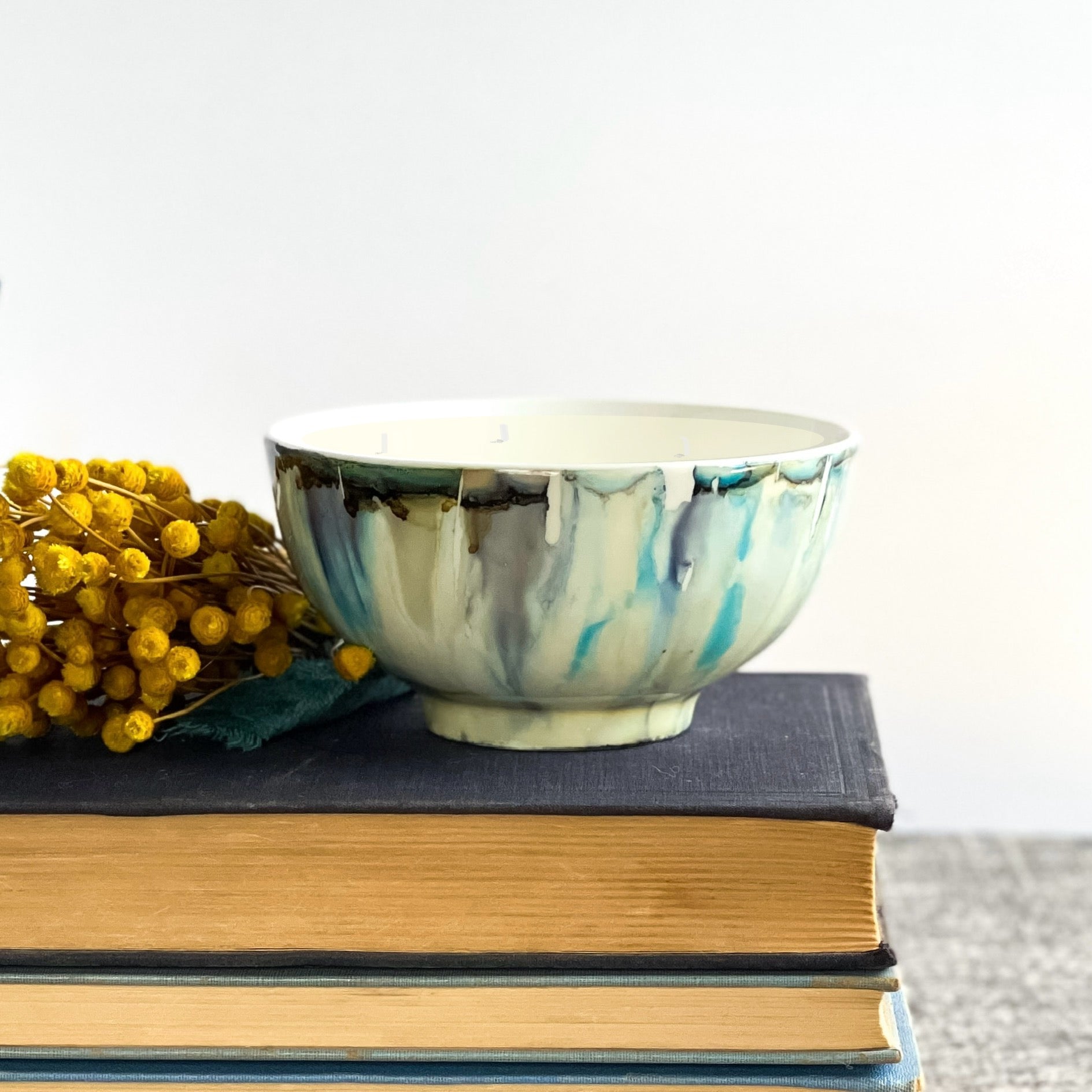 Handpainted ceramic candle in soft blues and grays