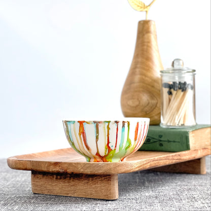 Ceramic soy candle handpainted in vivid reds, teals, greens, and yellows