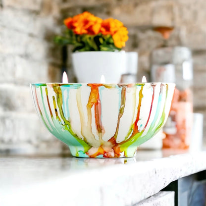ceramic soy candle handpainted in vivid reds, teals, greens, and yellows