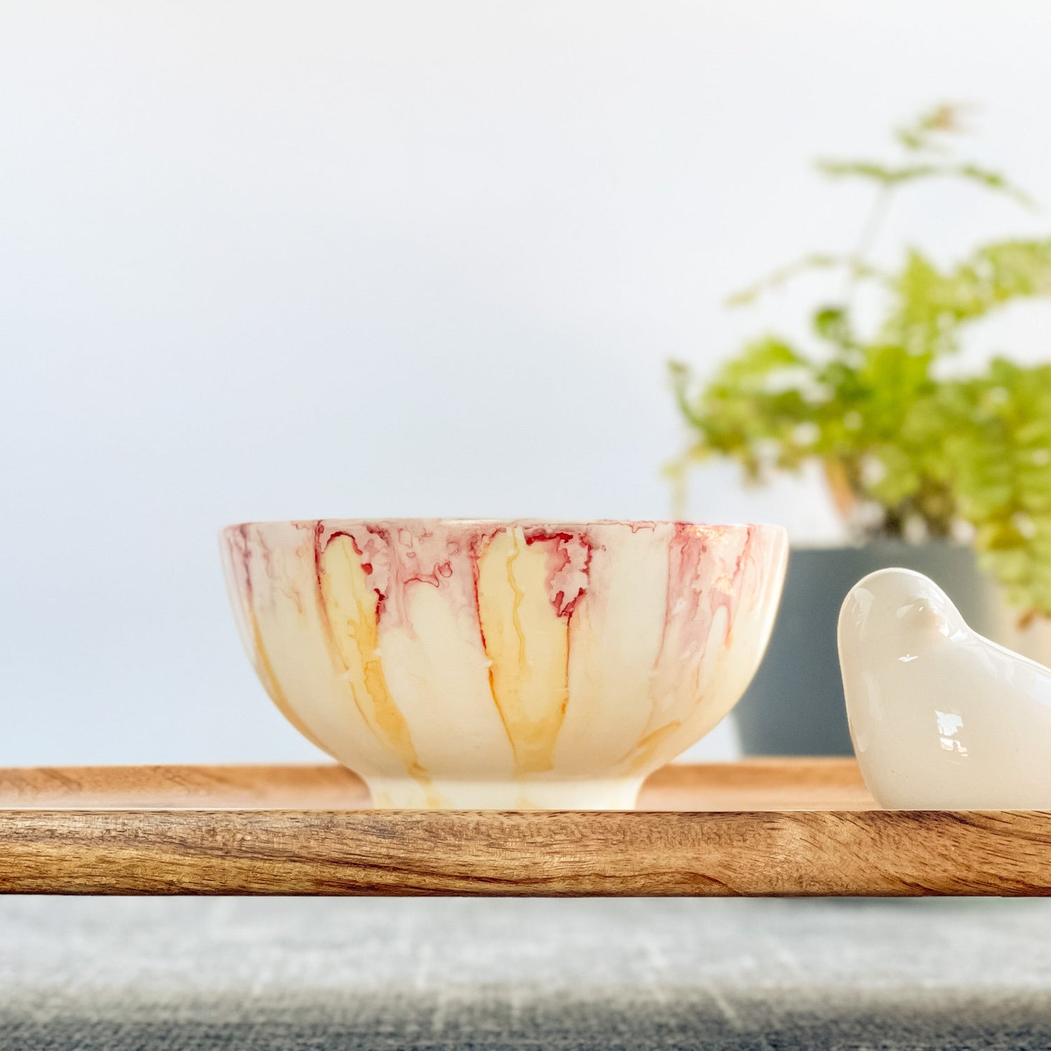 Handpainted ceramic candle in pinks and yellows